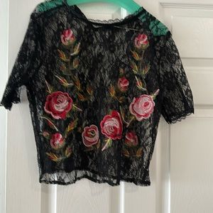 Black lace top with red roses, cropped style. Buttons in back.